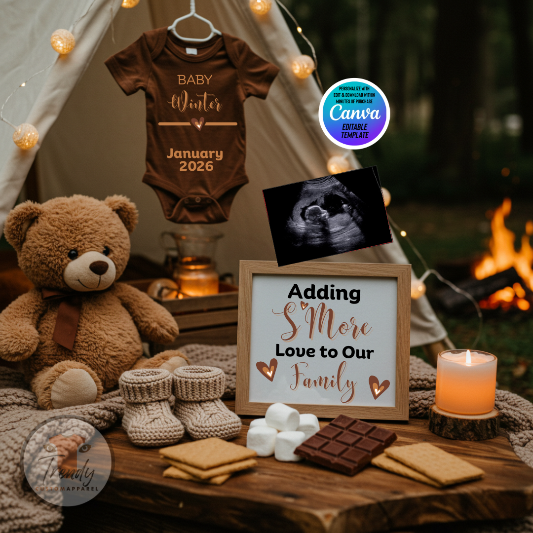 Baby shower setup with brown baby onesie, teddy bear, and 'Adding S'more Love to Our Family' sign.