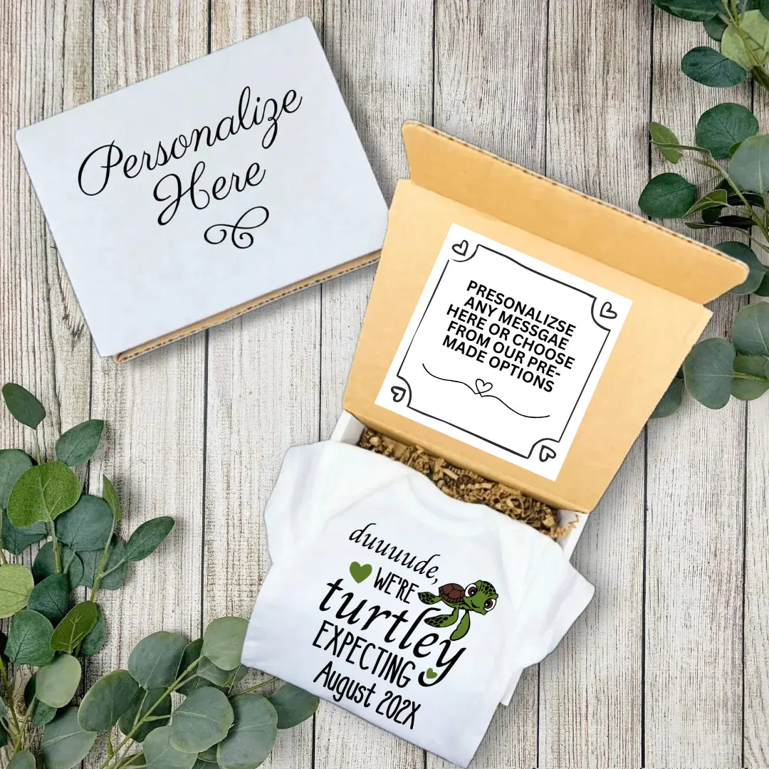 Personalized baby announcement towel with a box on a wooden surface