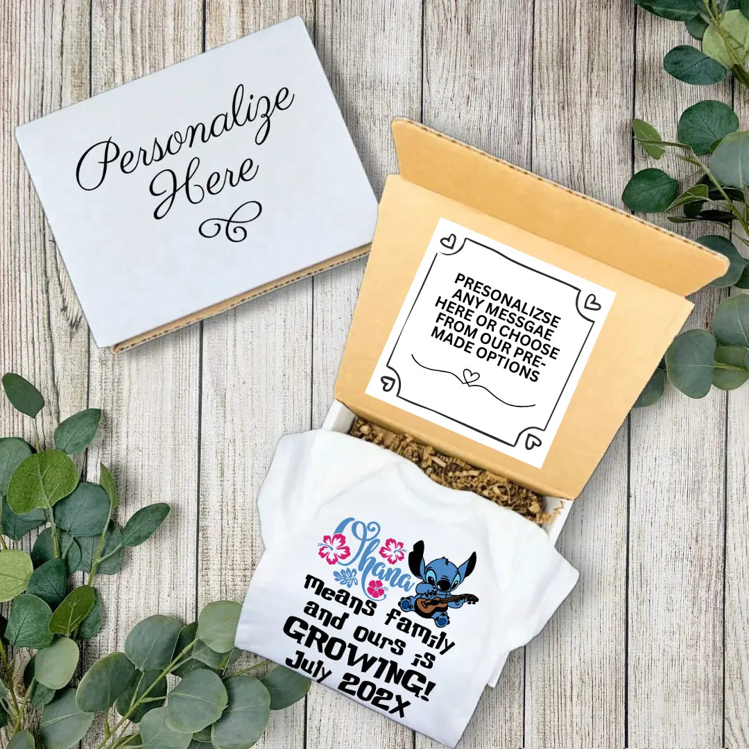 Personalized baby announcement towel with decorative box on a wooden surface